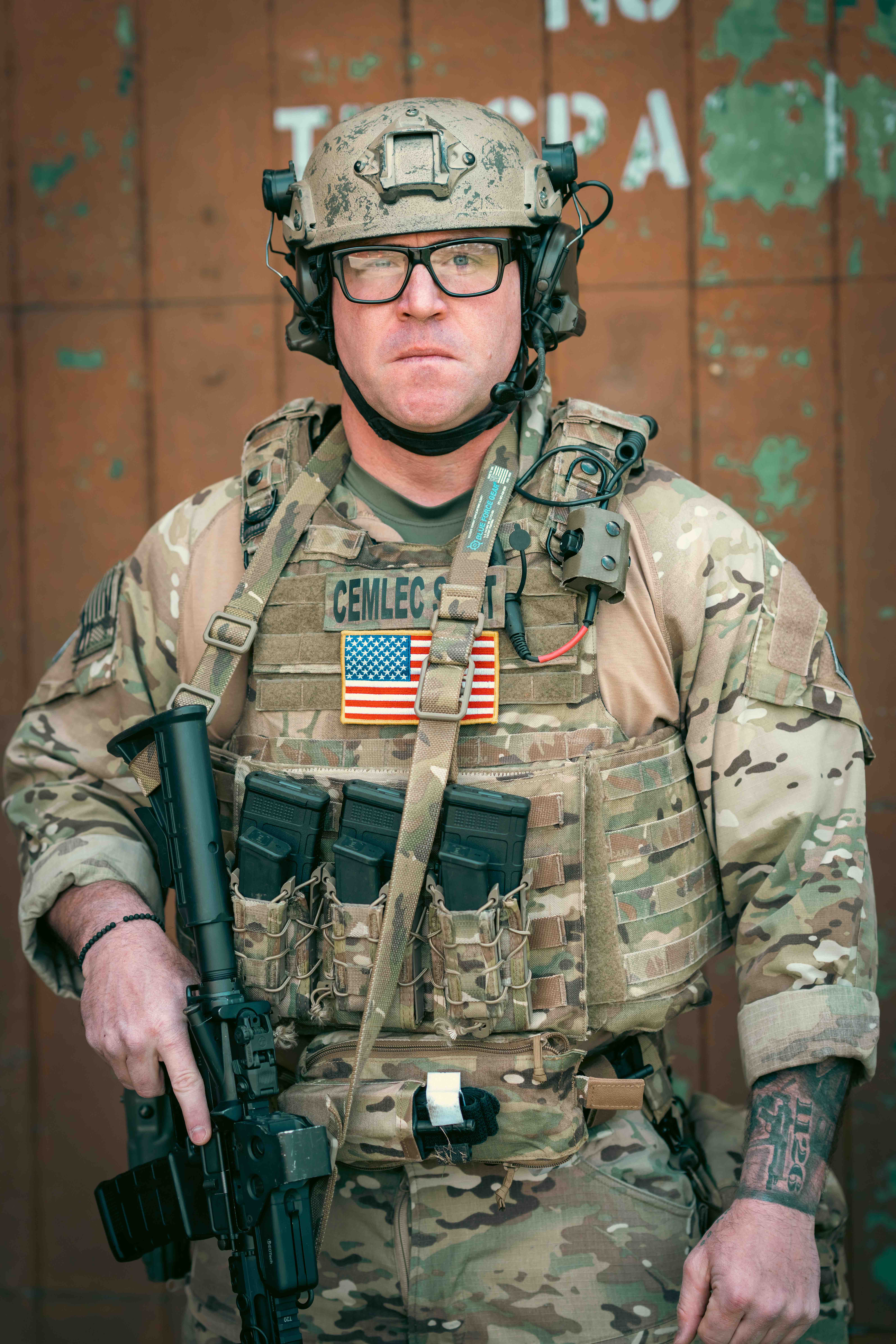 A SWAT team member stands in his gear.