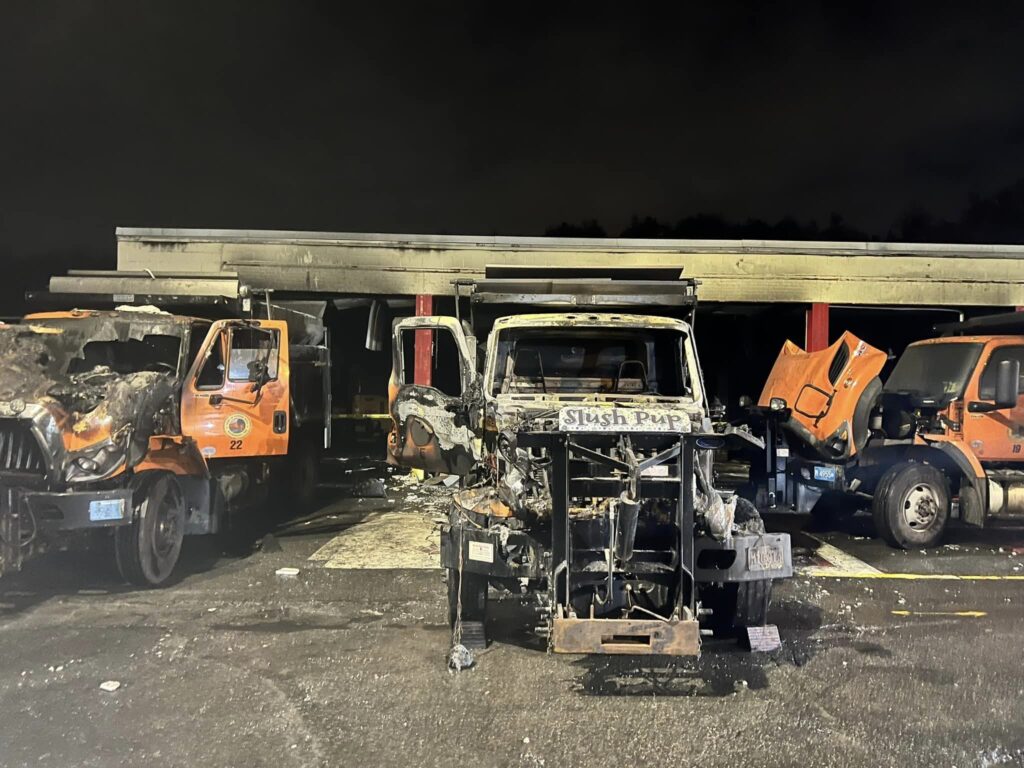 Charred remains of the DPW fleet after a garage fire.